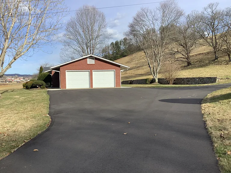Newly re-paved driveway and 2 car garage