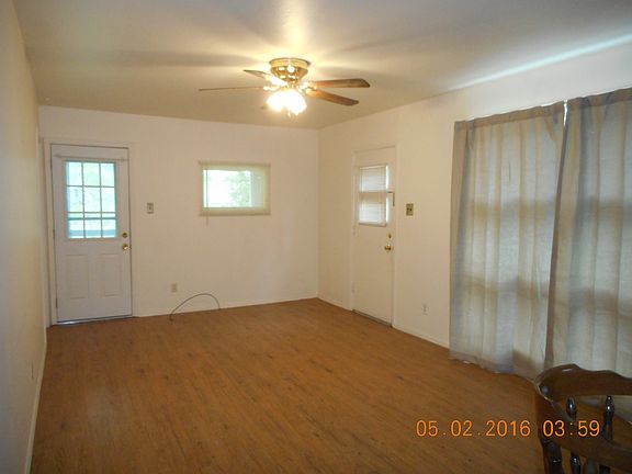 Living Room view to sun porch & entrance