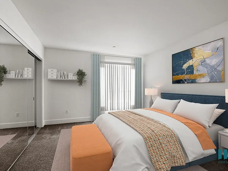 Bedroom with Mirrored Closet and Patio