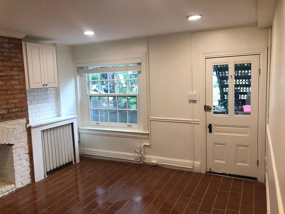 Kitchen/Living Room with giant front window and front door