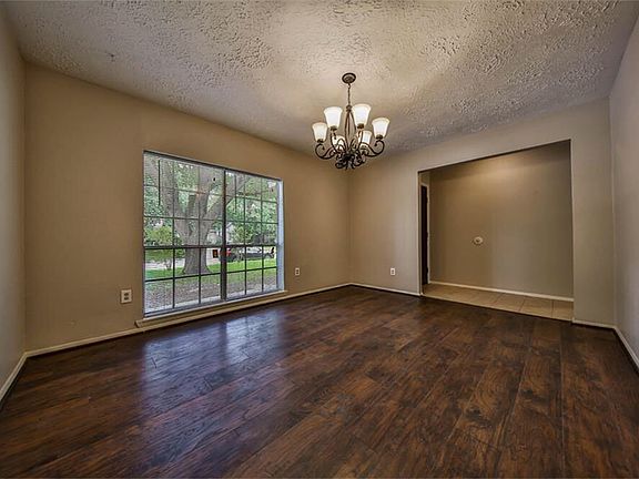 Dining area at the front of the house with updated floors an