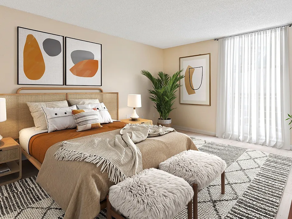Elevate your living at Lakeshore Preserve with this beautifully designed bedroom featuring modern art and cozy furnishings. Enjoy a serene atmosphere and plenty of natural light. Schedule a tour today to find your perfect home.