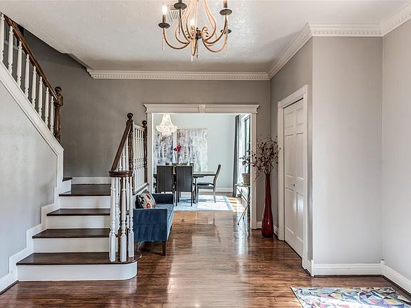 Bright and open is the best way to describe the feeling as you enter this large foyer space, flanked by the living room and formal dining room.
