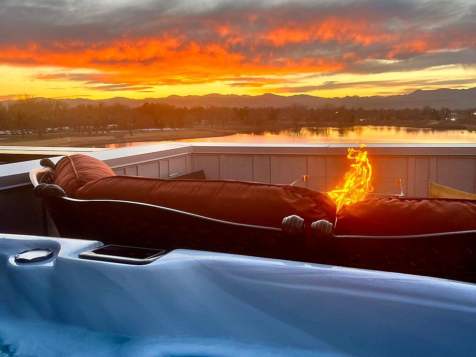 Breathtaking sunsets and warm bubbles await on our lakefront rooftop complete with luxury gas pebble firepit, propane grill, and circular couch. There are extra camp chairs to make sure everyone has a front row seat to the best sunrises and sunsets!