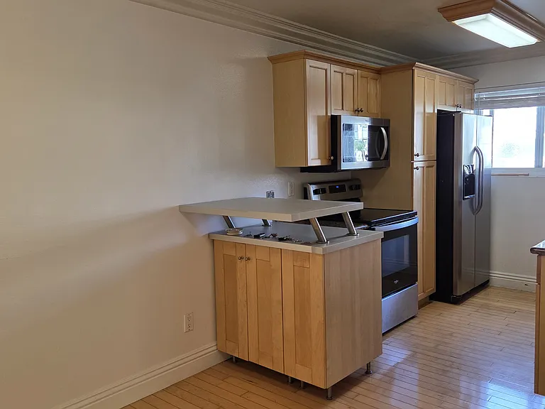 View of the kitchen, shows a space for a dining table