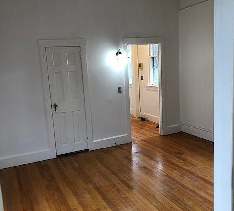 Living room with view towards kitchen