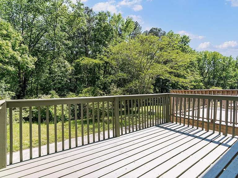 Brand-new elevated back deck overlooking a peaceful wooded backdrop _ ideal for morning coffee or entertaining