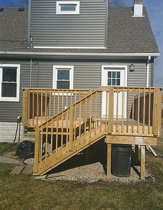large deck of rear door of house