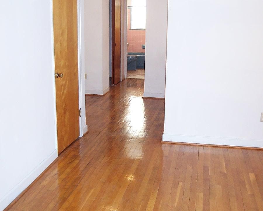 Living room through dinette area, hall with closet, and bath