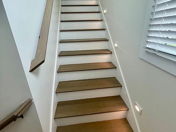 Stairs with low lights to second floor.