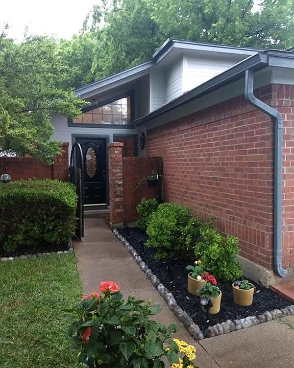 Doorway to property with brick siding. This is an older picture of the homes potential.
