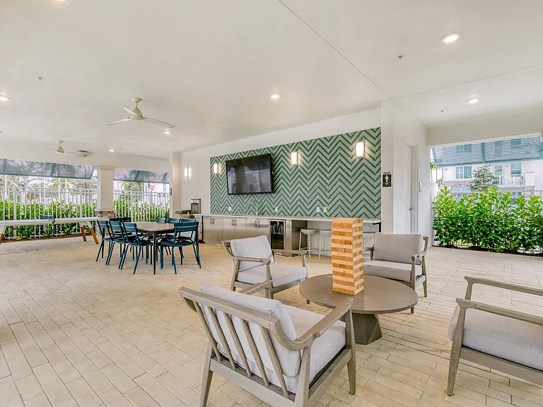 Our poolside pavilion and outdoor kitchen and lounge seating.