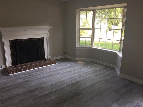 New vinyl plank flooring with wood fireplace