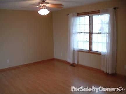 Formal front living room with wood floor.