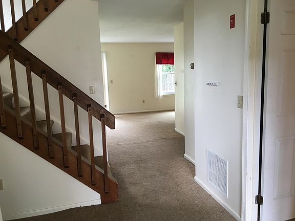 Front entryway with laundry room on right and large closet and half bath on left.
(Curtain not included in dining area)