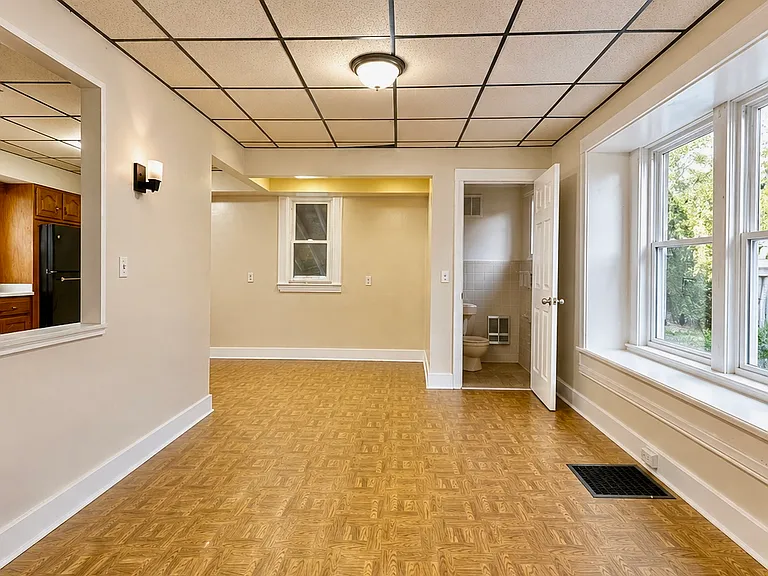 Bright and welcoming dining area with excellent natural light and a clean, open layout. Conveniently includes a half bathroom on the same level, adding comfort and accessibility for guests or elderly family members who prefer to stay on the main floor.