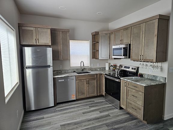 New kitchen, granite counters, new appliances, wine glass rack