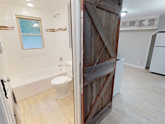 Renovated Bathroom with Custom Barndoor