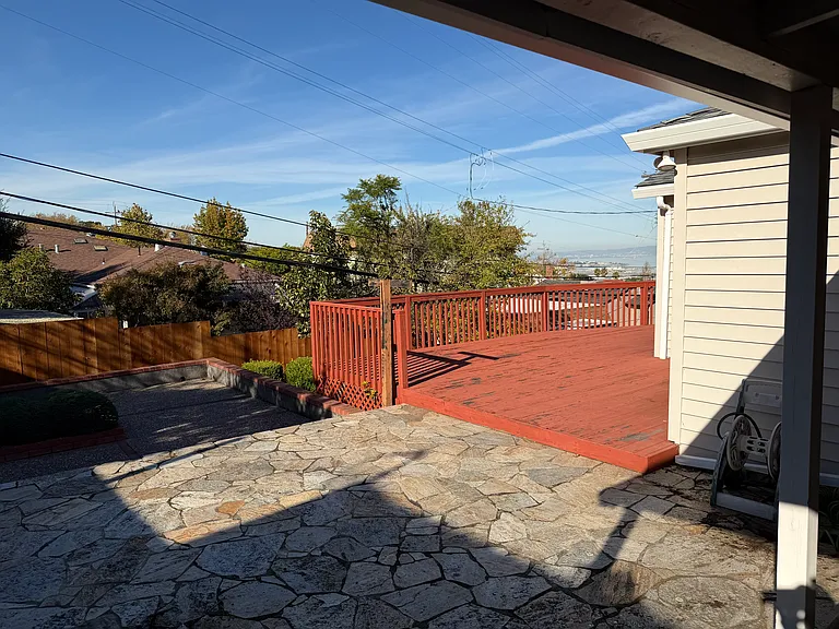 low maintenance backyard, with wooden deck, with views of SFO