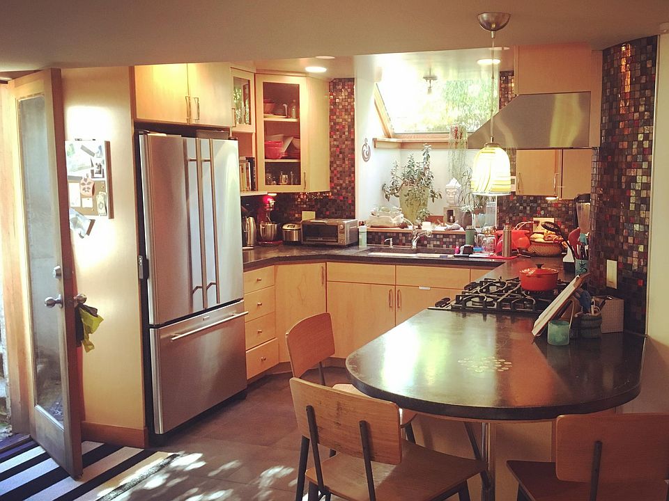 Eat in kitchen with high end appliances and heated tile floor.