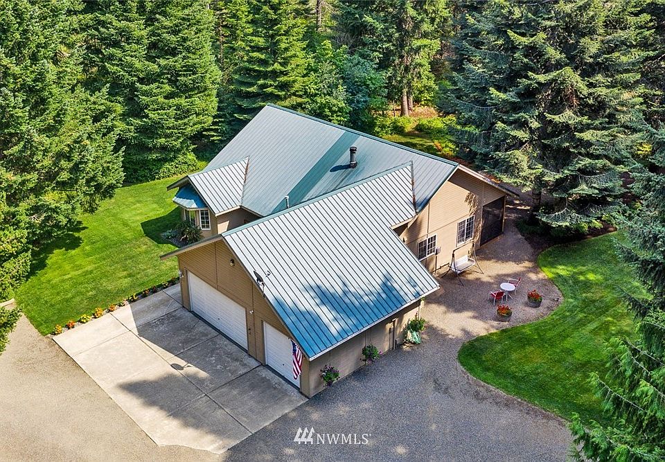 Nestled in this evergreen oasis, a home that has been cared for and loved could be yours.  Manicured landscape, updated interior and your own private space await you on this 5 acre treasure.  