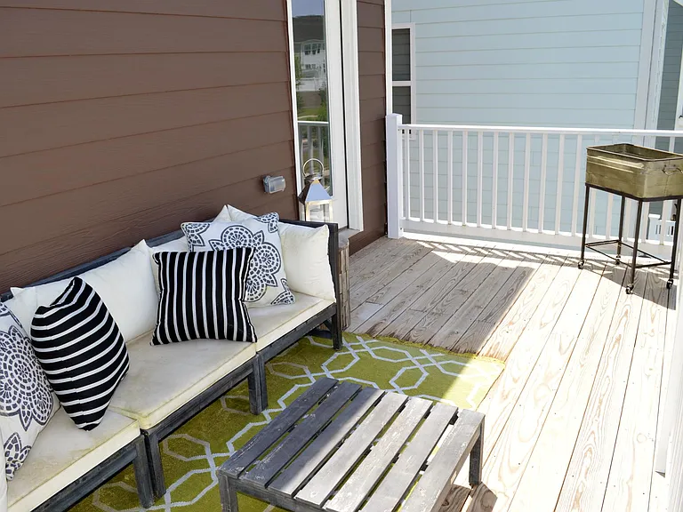 This balcony off the living room is a wonderful upgrade to the house, allowing a nice spot for rest and relaxation.