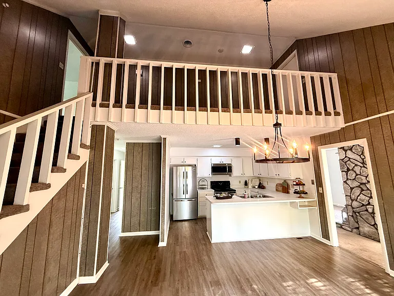When you get to the top of the stairs the door into the home is basically at the high point under the stairs. You go straight to the bedrooms or go to your right immediately into the kitchen area. So is very conveniently located to enter the home.