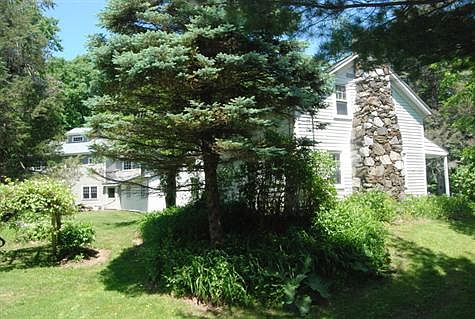 RAMBLING HOUSE AND OFFICES FROM THE ROAD
