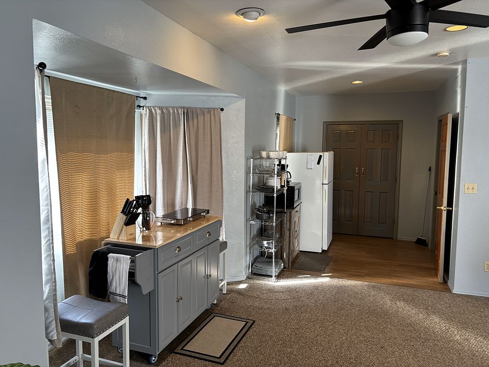 Looking from fireplace to dining/kitchen area
