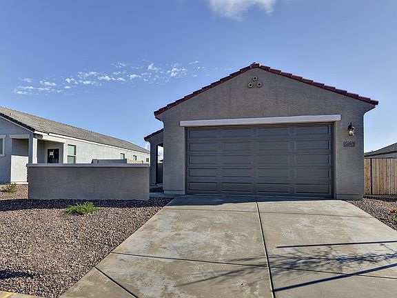 Move in now to the Juniper floorplan at 36913 N Sidewinder Dr at Archer Meadows.