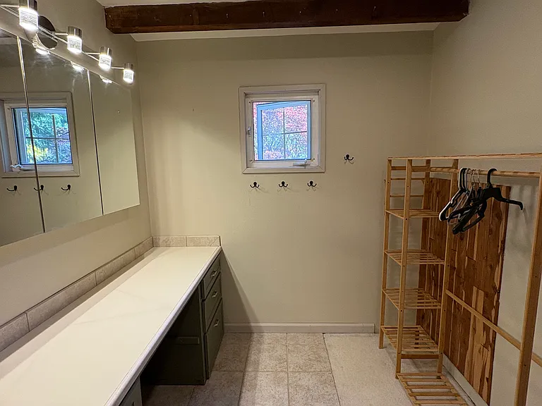 primary br ensuite dressing room with built in dresser