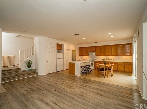 Spacious living room opens to kitchen