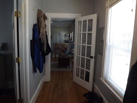 Entry hall into living room; large bedroom on left