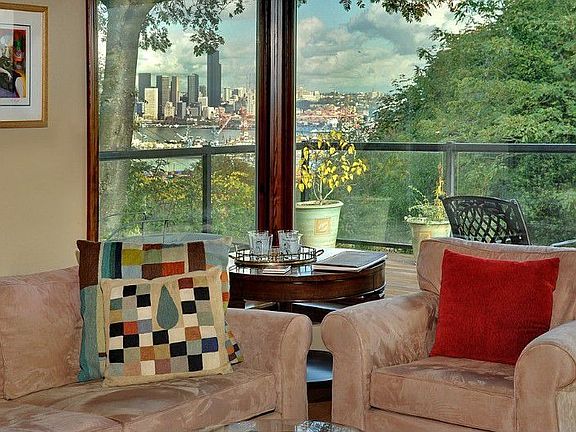 Day time and night time views of the City of Seattle.