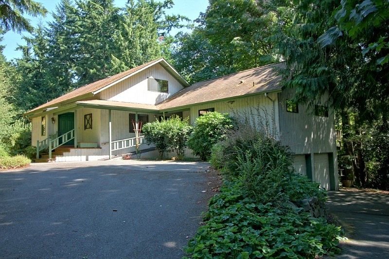 Rustic Charmer includes separate MIL apt and 2-car garage all on secluded 2.1 acres