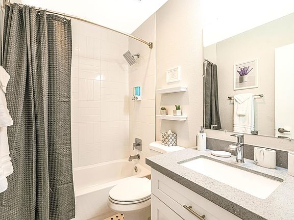 Bathroom with shower and bathtub