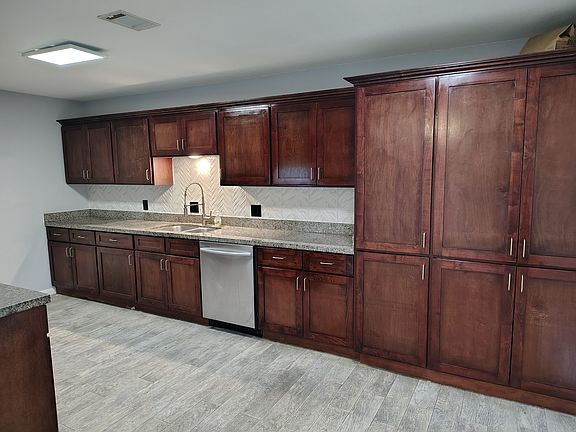 sink side showing the large pantry cabinets