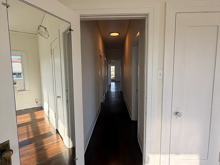 the hallway from the main bedroom to the living room
