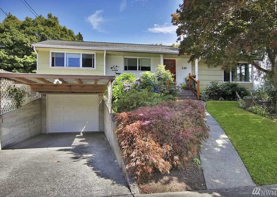 Classic mid century Fircrest home with carport, garage, and room for additional off street parking.