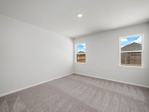 The master retreat has its own walk-in closet and bathroom.