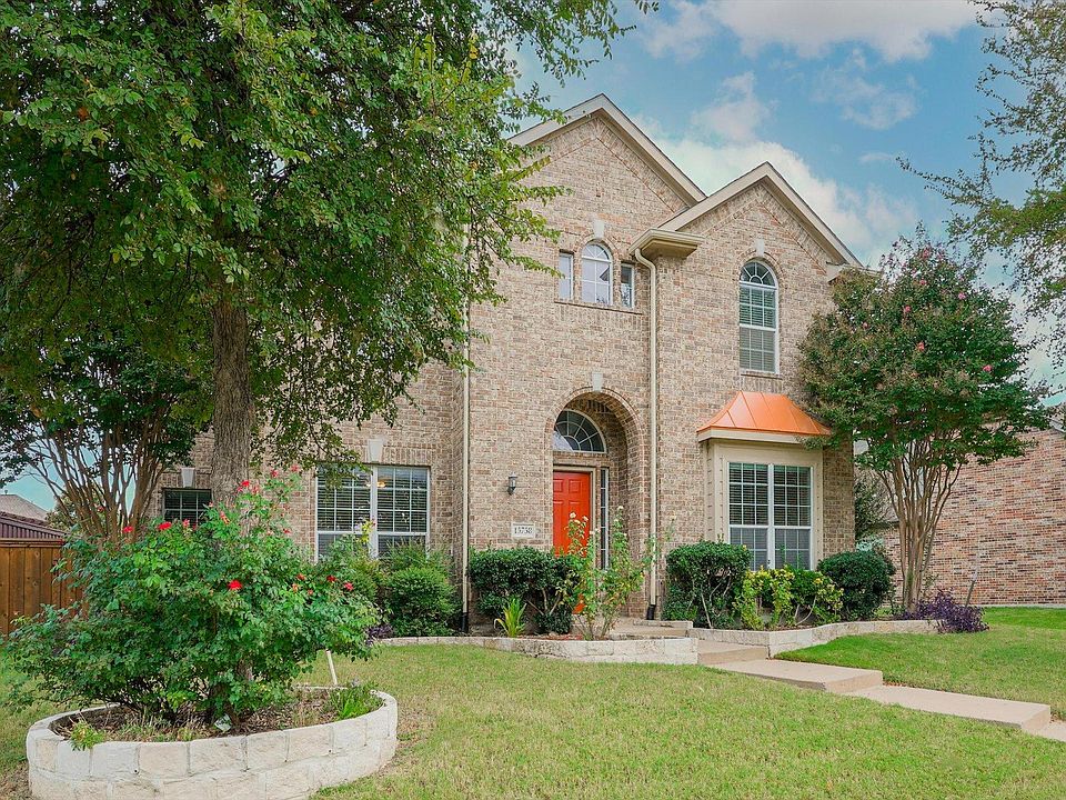A beautiful brick elevation welcomes you to 15758 Twin Cove Drive.