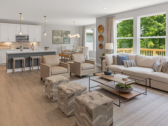 family room with windows overlooking deck