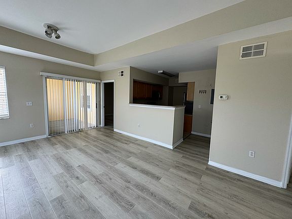 Open Living Room and Dining Room with side balcony