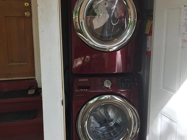 Laundry with assigned and open times adjacent to the apartment.