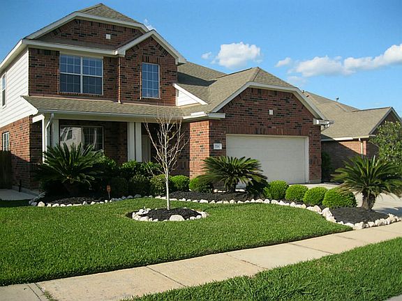 Left side view of home. Front door has key coded lock for extra security or if you have a child who 