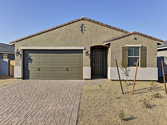 Move in now to the Leslie floorplan at 1308 S 224th Lane at Coyote Ridge.