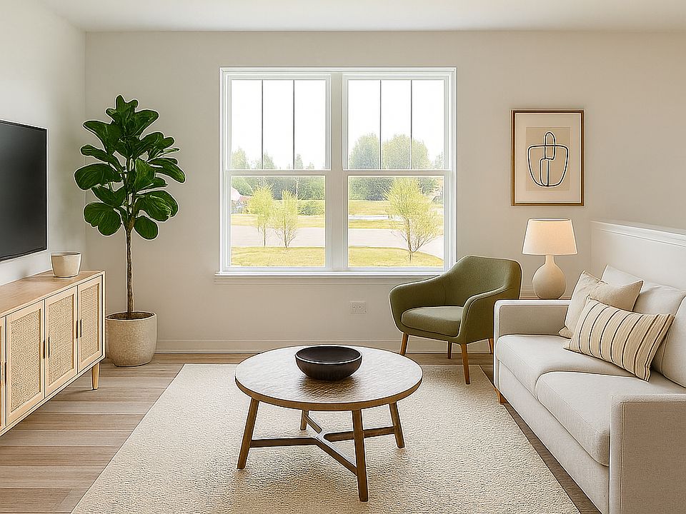 Spacious open-concept living area with large windows and neutral finishes for a modern look.