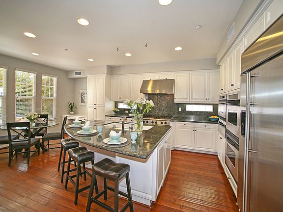 Gourmet Kitchen With Built-In Refrigerator, Dual Ovens, 6-Burner Stove & Warmi