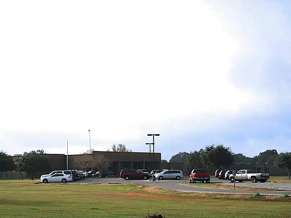 Needville Elementary School is literally behind the house.
