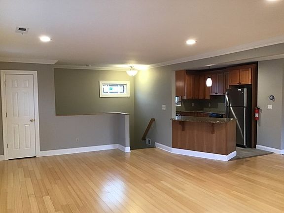 view of the kitchen and entrance area. Recessed lights